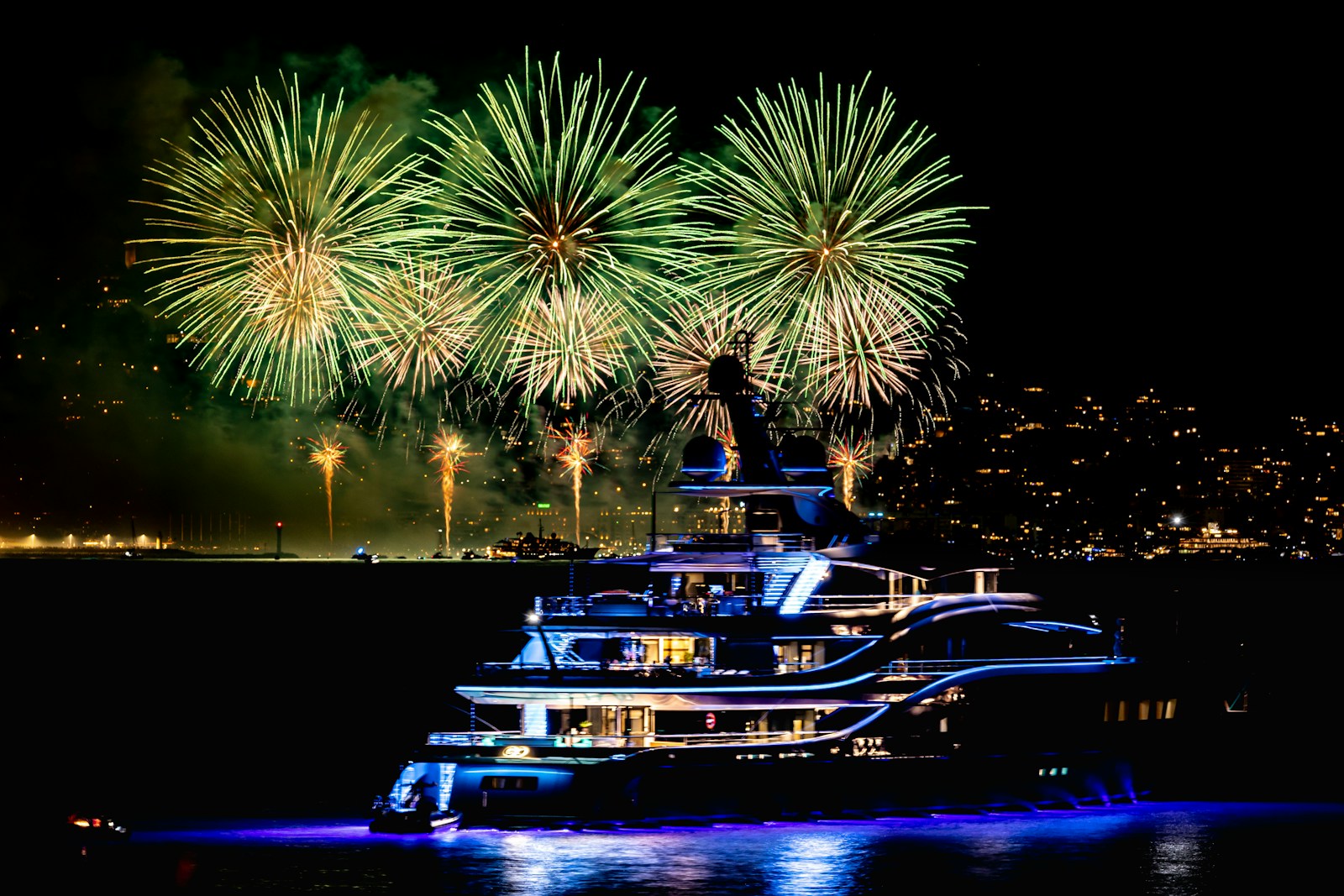 Fireworks over the water on a coastal summer night
