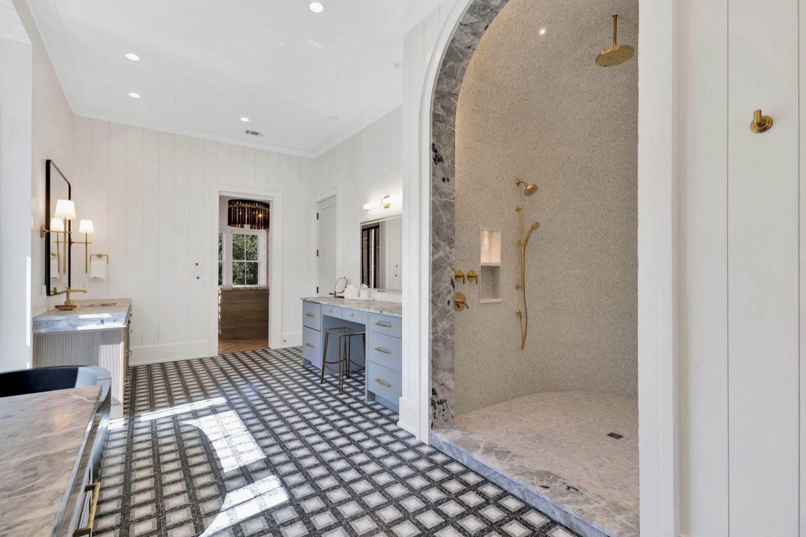 15 Bald Eagle primary bath with arched stone shower — professional listing photography
