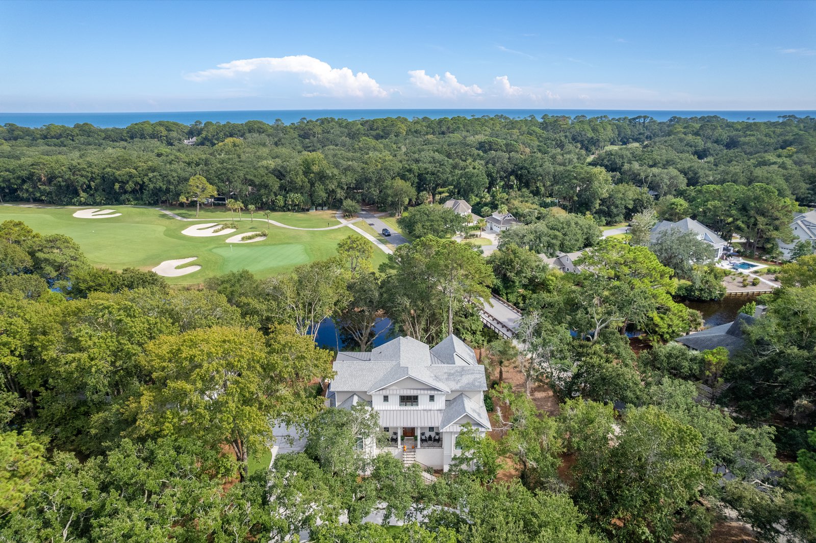 2 Midstream, Palmetto Dunes — aerial photography placing the home between the golf course and the ocean horizon